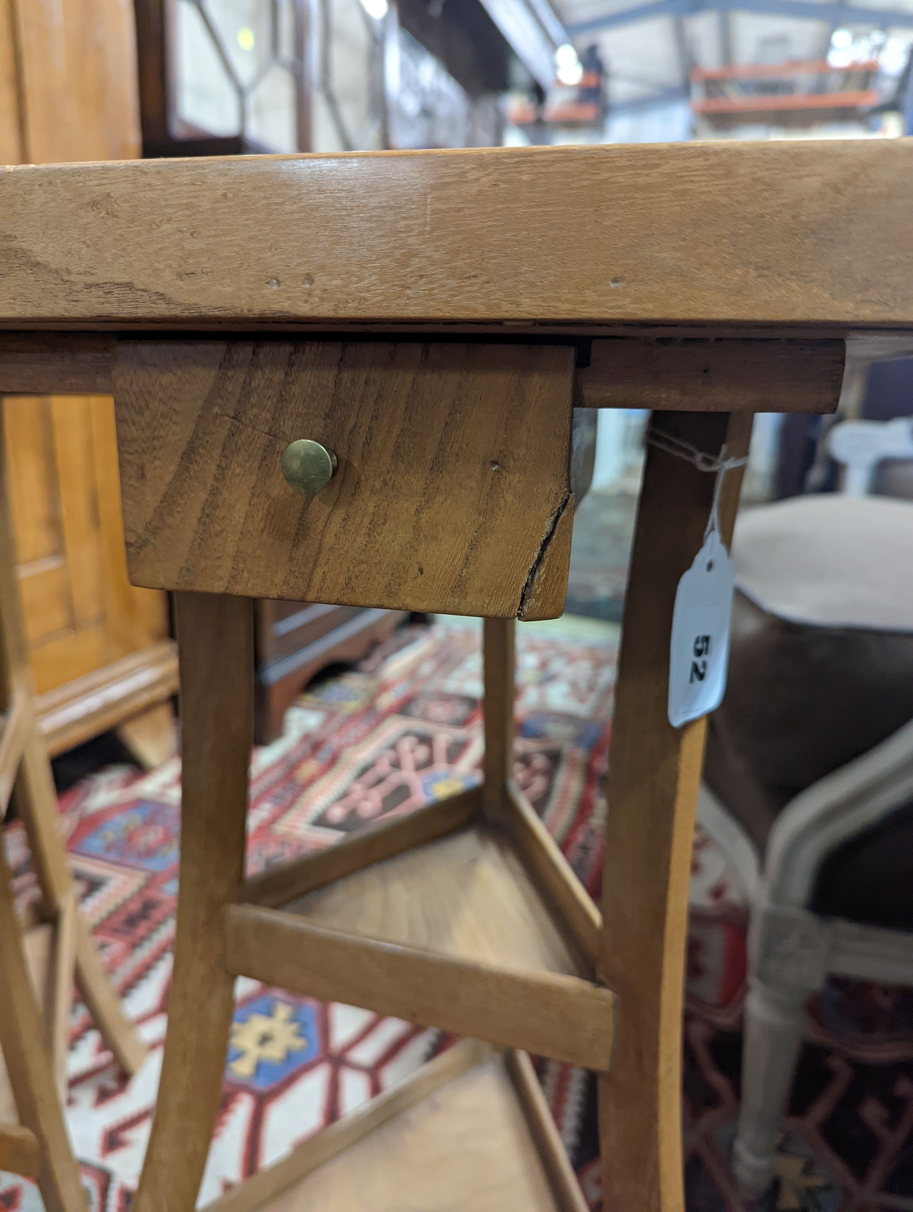 A pair of 1950's French design fruitwood square top three tier occasional tables, width 31cm, height 68cm